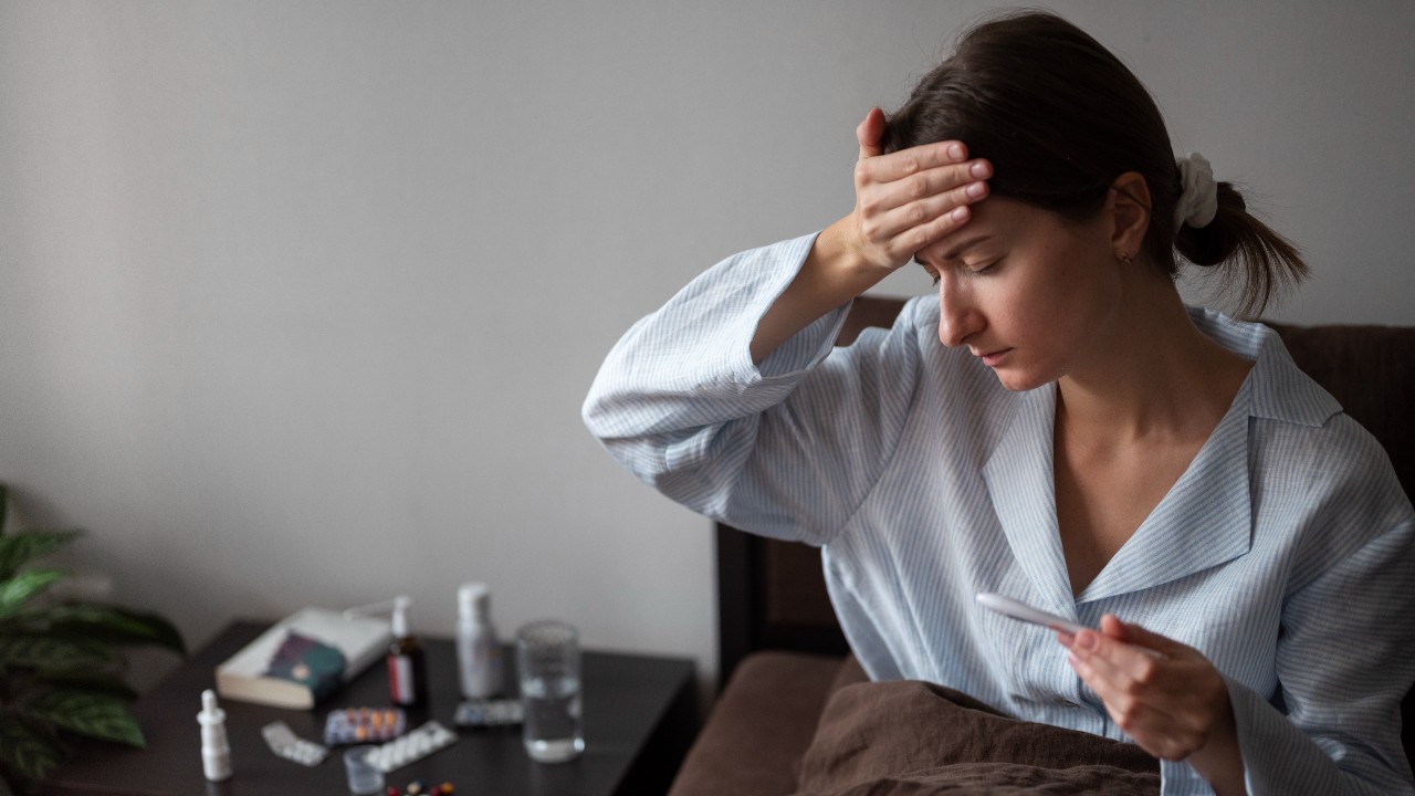 medium shot sick woman with fever